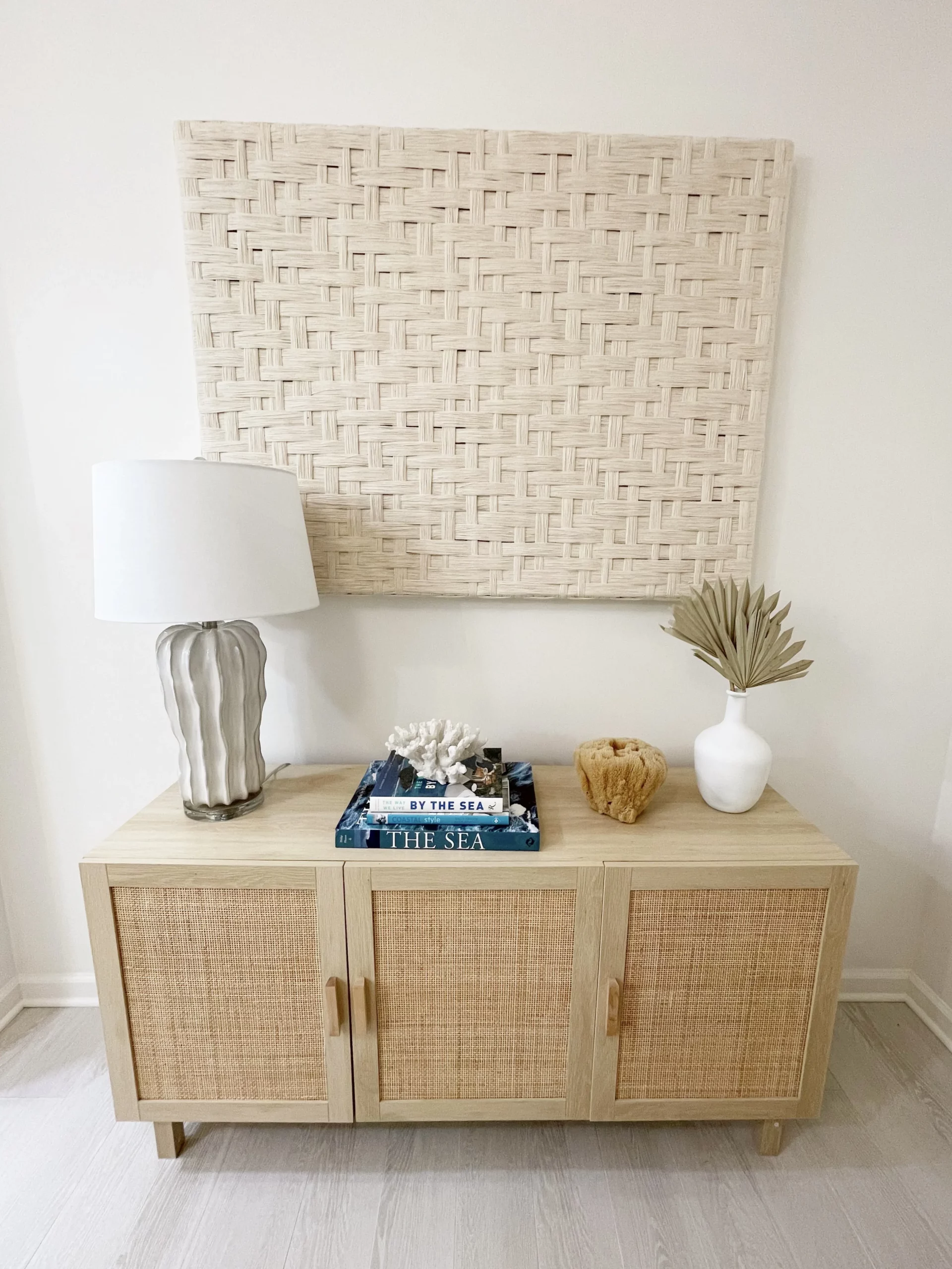 master bath meadowcross - long side table, with decorations and wall art