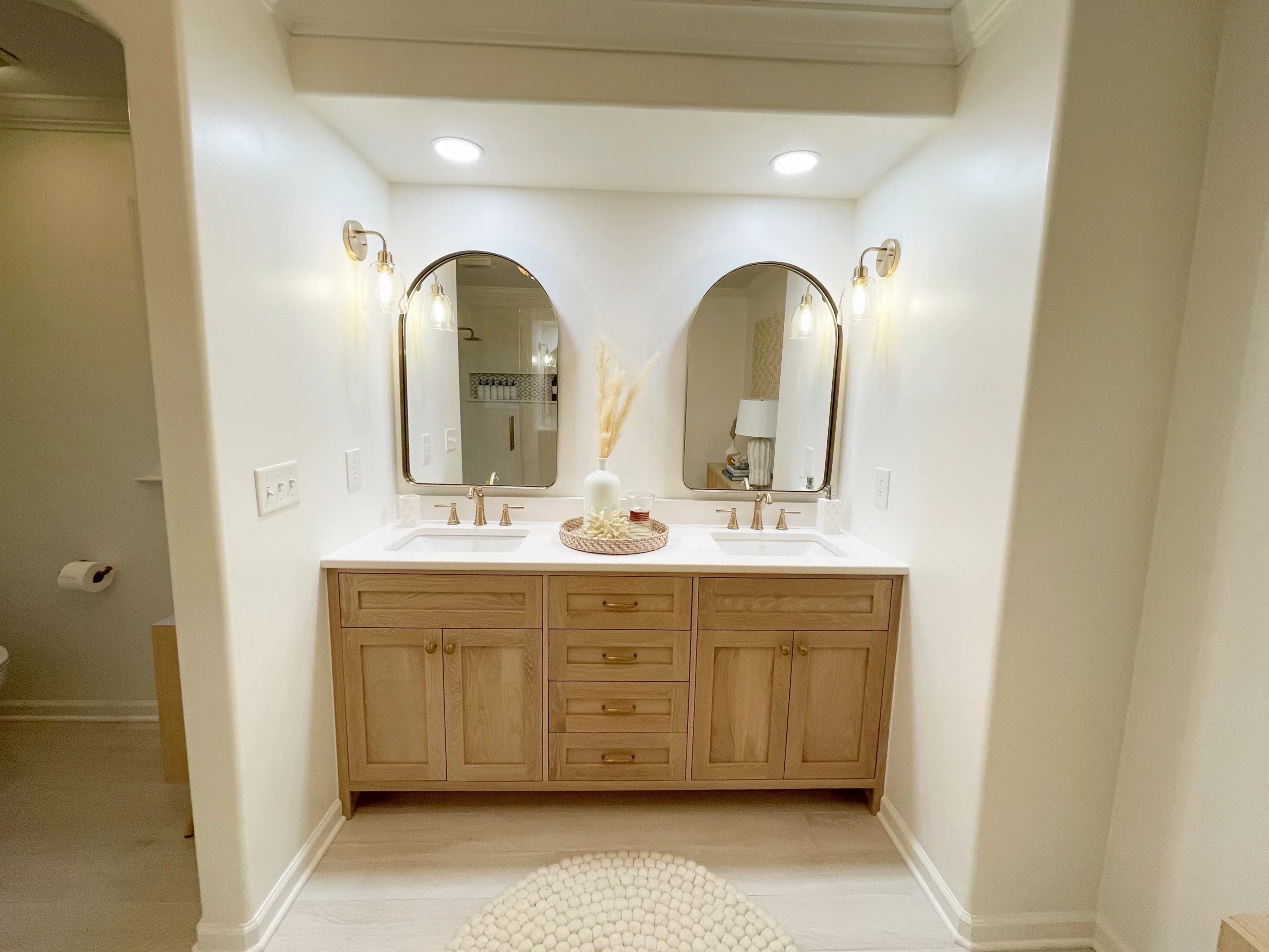 master bath meadowcross - double sinks, pampas grass, rounded mirrors